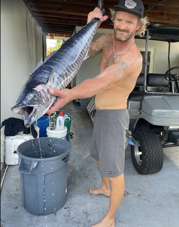 Captain Adam Hastings with a large wahoo